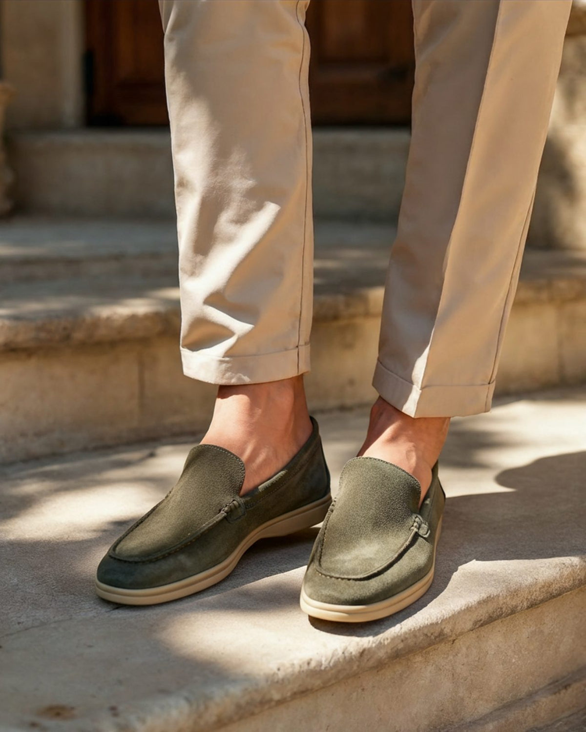 Olive suede loafers worn with stone chinos
